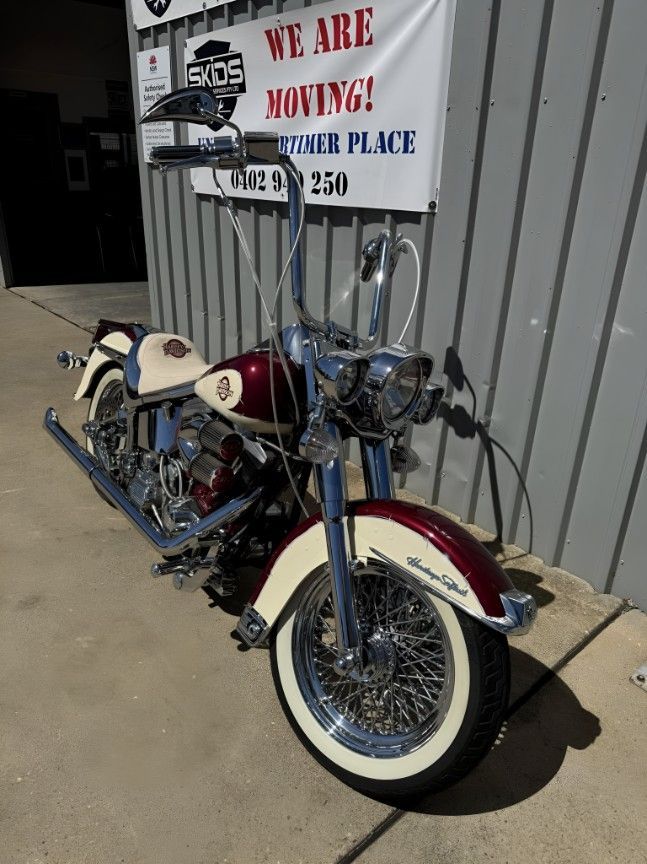 A Motorcycle is Parked in Front of a Sign — Skids Mechanical Services Pty Ltd in Wagga Wagga, NSW