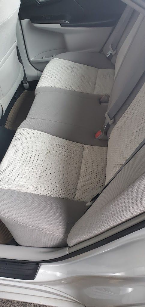 A close up of the back seat of a car.