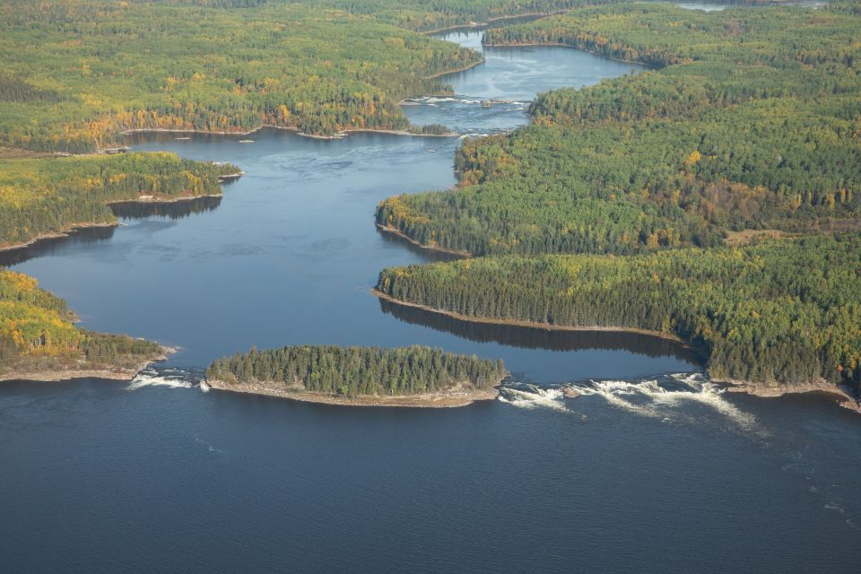 An aerial view of a large body of water surrounded by trees.