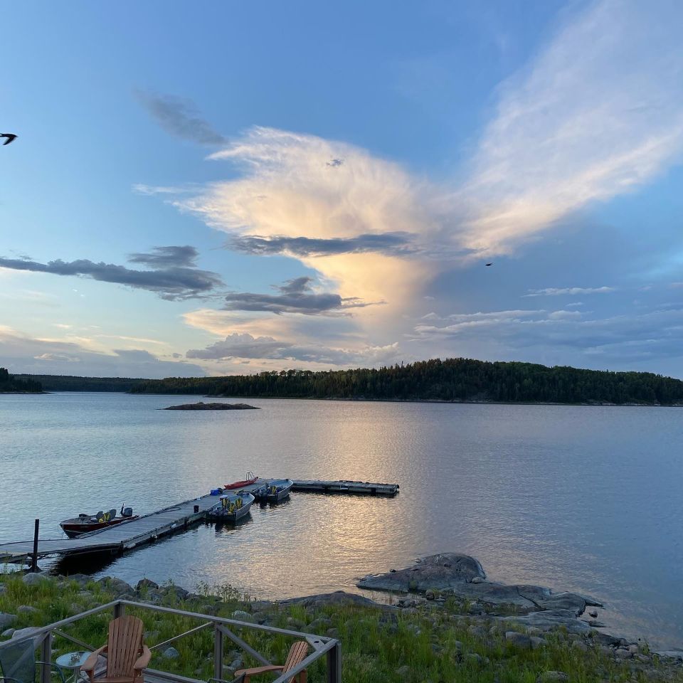 A large body of water with a dock in the middle of it.