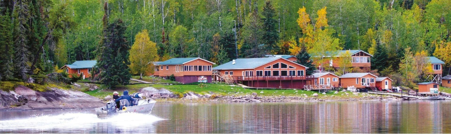 A view of Oak Lake Lodge from the air. A main lodge for dining and several private fishing cabins.