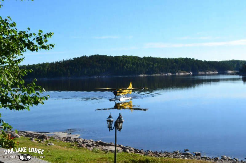 A seaplane is floating on top of a lake