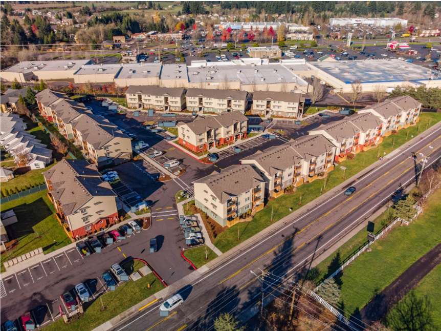 Lafayette Place Apartments in McMinnville, Oregon, near Linfield University – apartment community aerial view and parking lot