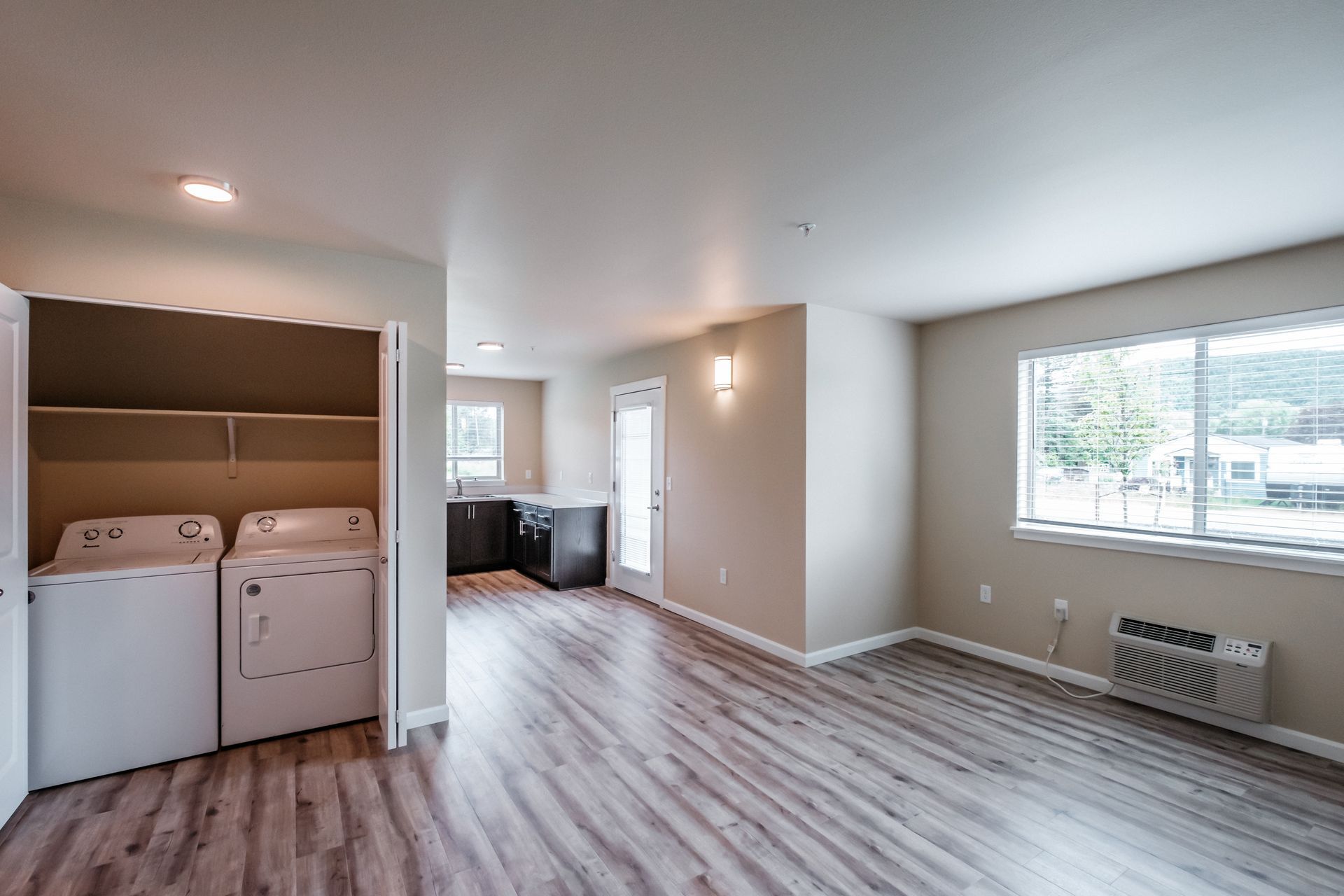 Santiam Gateway Apartments in Sweet Home Oregon, two-bedroom two-bathroom – living room, heater washer and dryer.