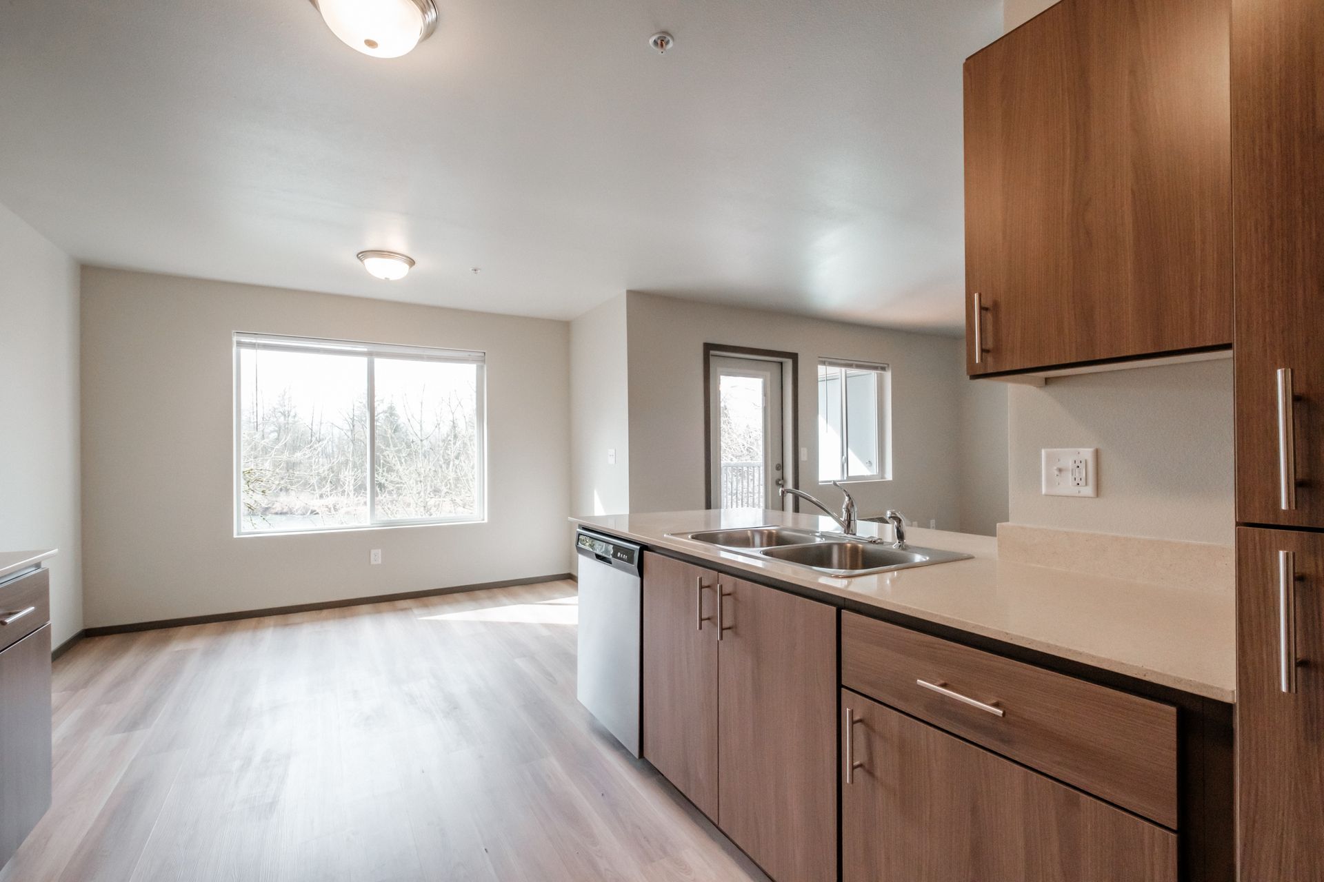 Jefferson Terrace Apartments in Jefferson Oregon – cabinetry, kitchen sink and dining room.      