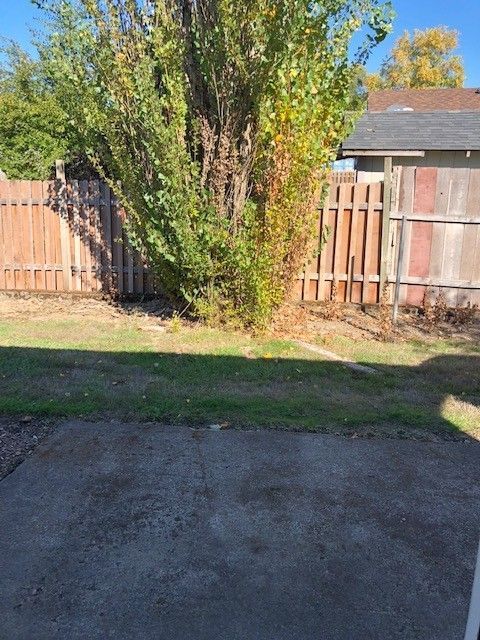 Prairie Place Duplexes in SE Albany OR, two-bedroom, one-bath – big bush in yard.