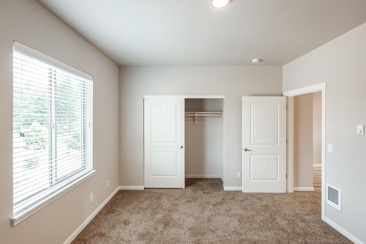 Hickory Hollow Apartments in North Albany OR, one-bedroom one-bathroom – bedroom closet and window. 