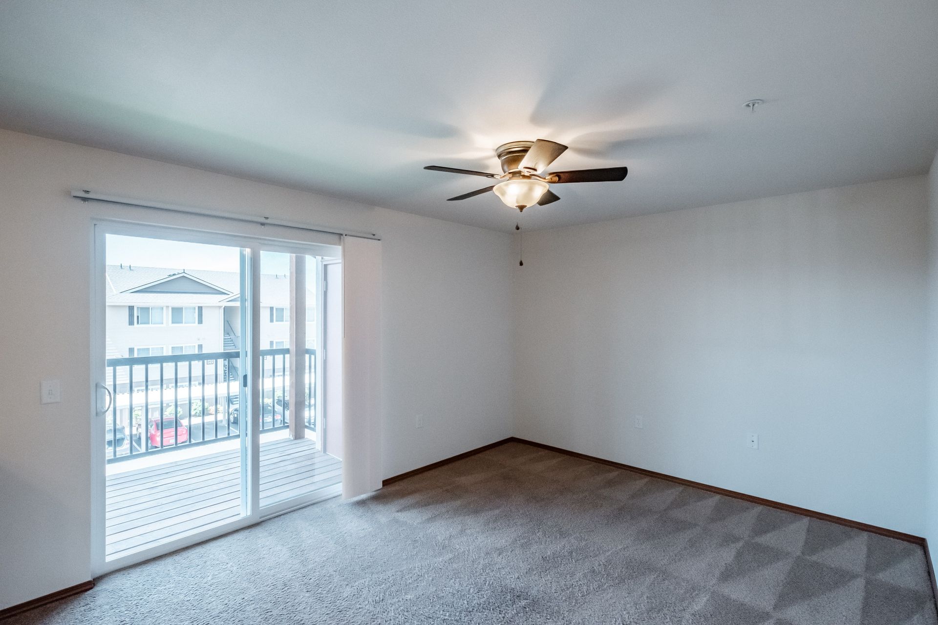 Newcastle Place Apartments in Salem, OR Near Chemeketa Community College, two-bedroom, two-bath –living room, glass door view