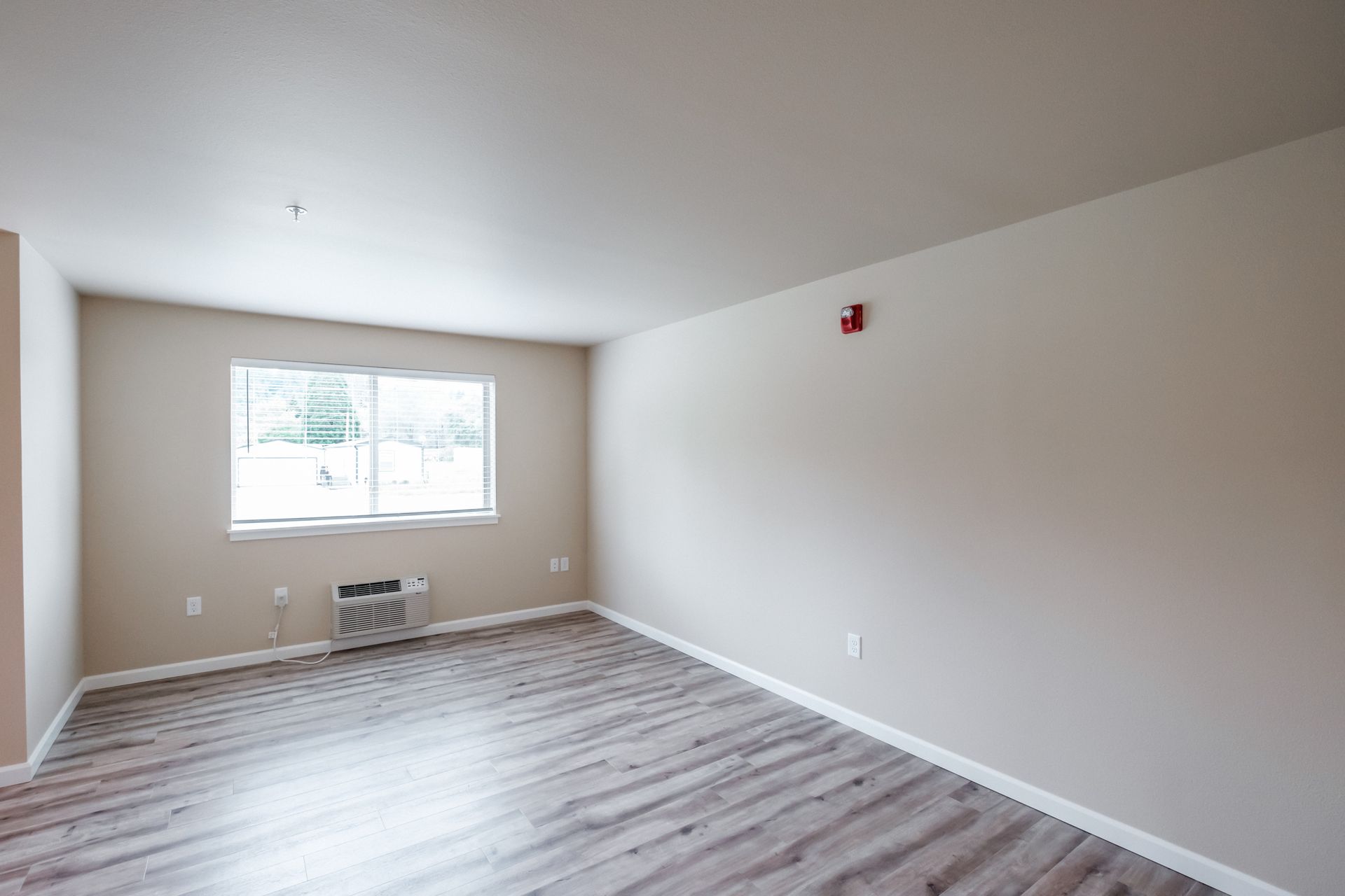 Santiam Gateway Apartments in Sweet Home Oregon, two-bedroom two-bathroom – living room window and heater.