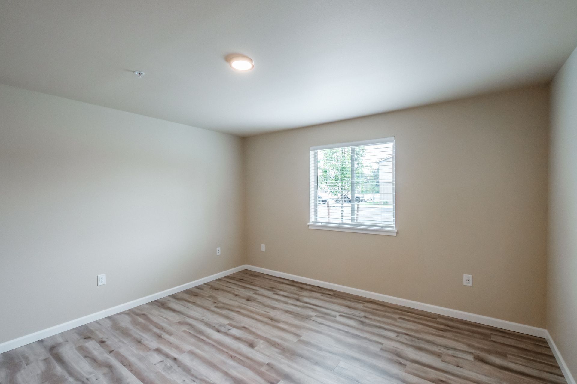 Santiam Gateway Apartments in Sweet Home Oregon, two-bedroom two-bathroom – master bedroom and view -1.