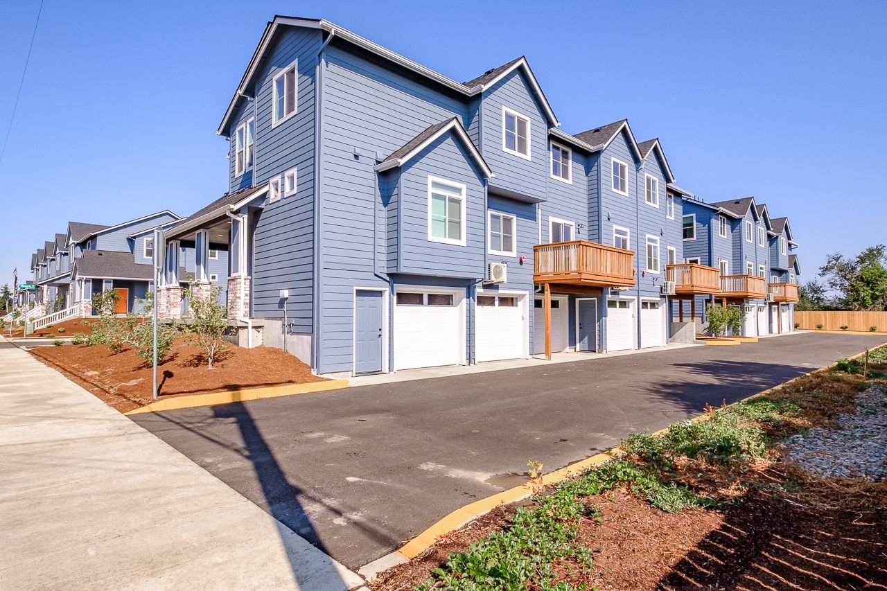 Goodnight Townhomes in Corvallis, OR, Near Oregon State University – apartment community exterior balconies and garage doors.