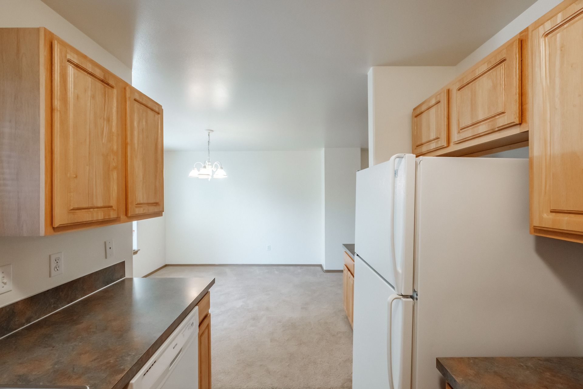 Mt. Vernon Town Homes in Albany Oregon, three-bedroom two and ½ bathroom – kitchen, refrigerator, cabinetry.