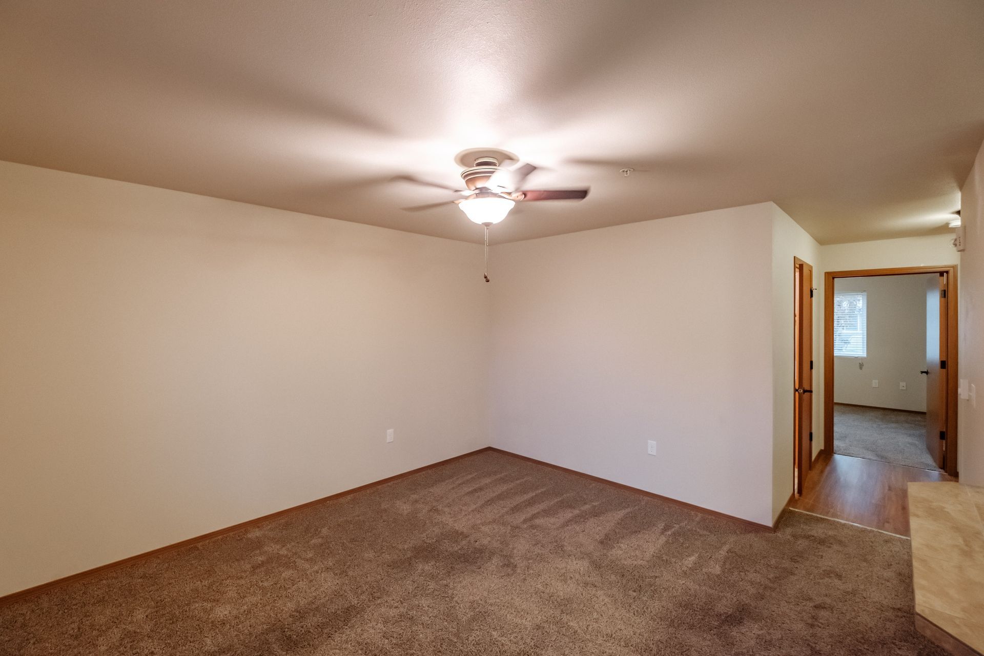 Lafayette Place Apartments in McMinnville, Oregon, near Linfield University – one-bedroom one-bath – living room to hallway. 