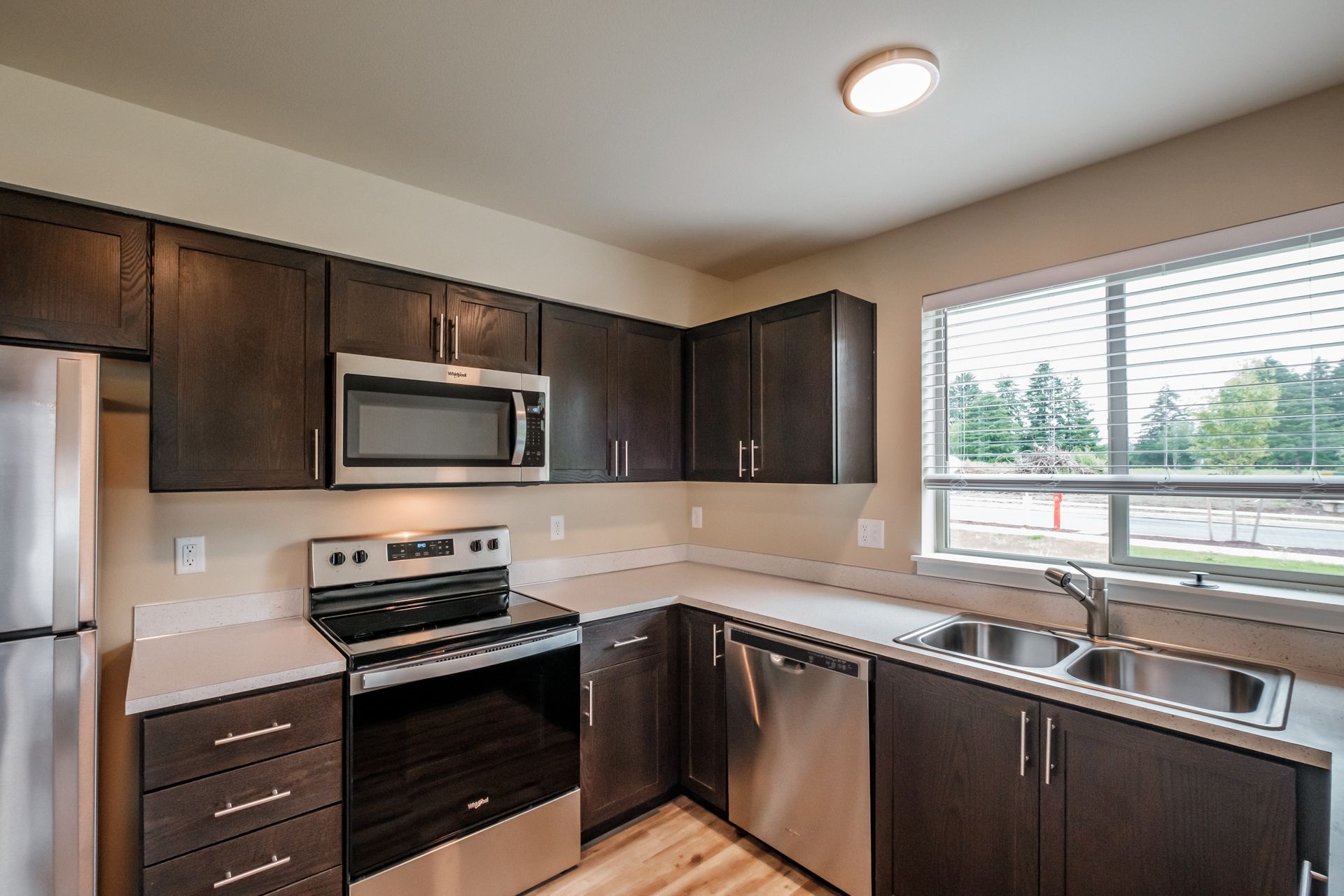 Santiam Gateway Apartments in Sweet Home Oregon, two-bedroom two-bathroom – kitchen and window view.