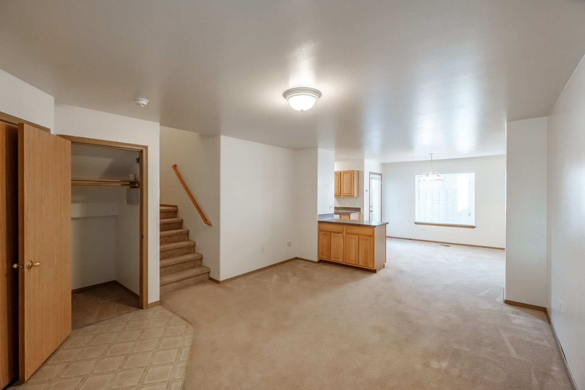 Mt. Vernon Town Homes – in Albany Oregon – entryway, front room, coat closet and staircase.