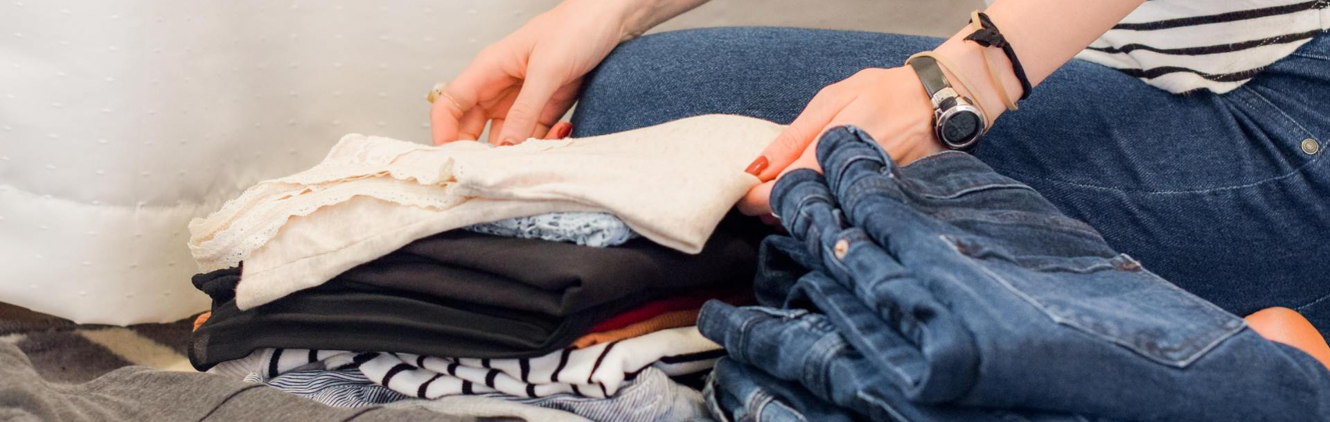 Woman Folding Clothes