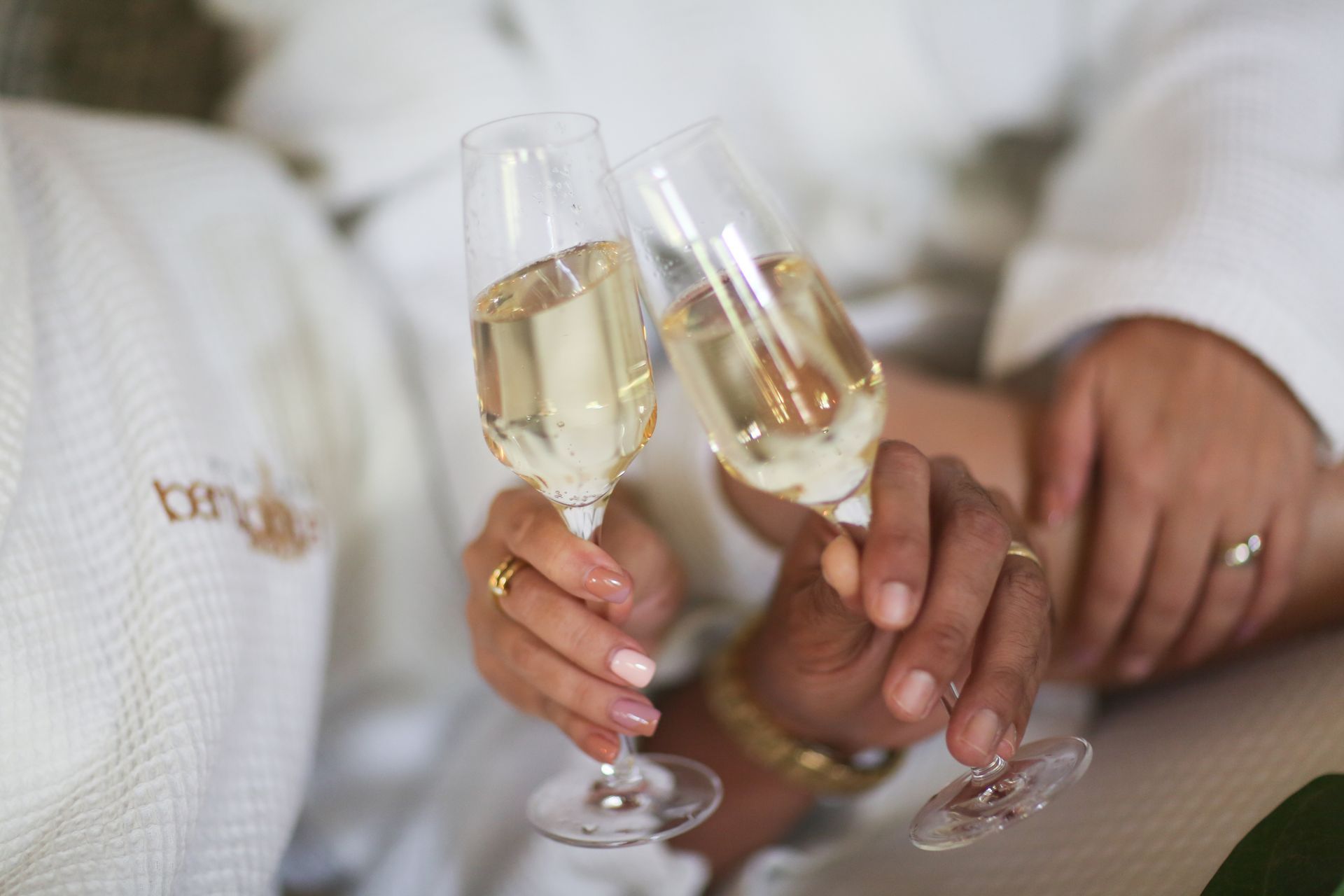 A man and a woman are toasting with champagne glasses.