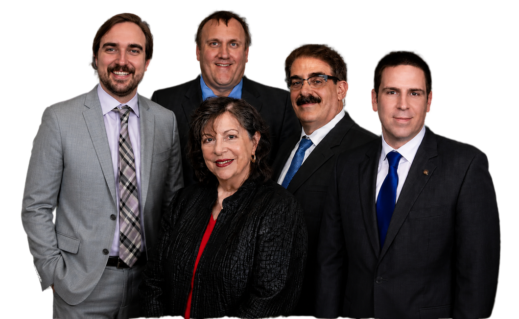 Five professionals in business attire posed against a white background.