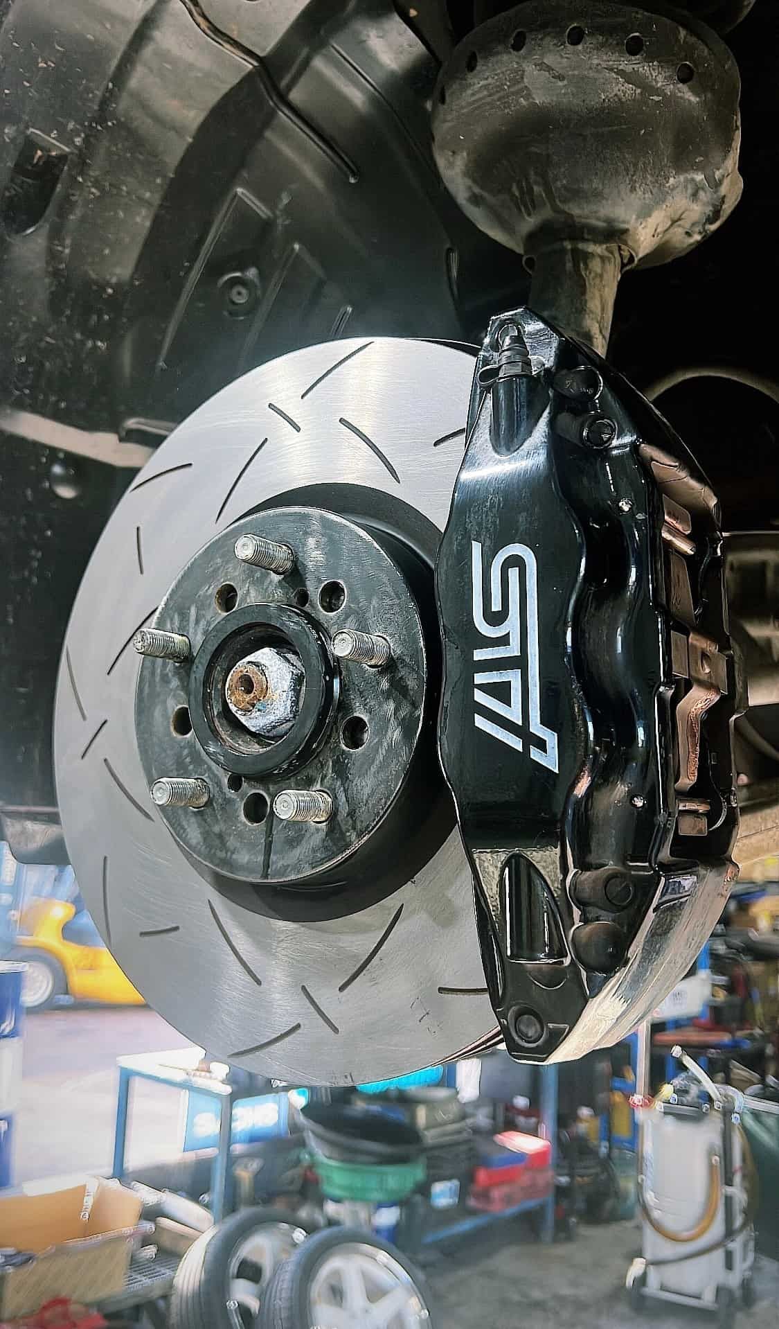 A Close Up of a Brake Disc on a Car in a Garage — AWS Mechanical in Stuart Park, NT