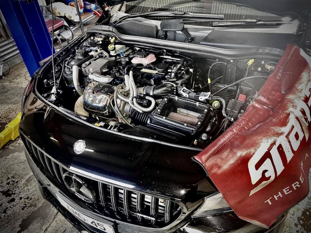 A Car In Mechanic Shop with The Hood of the Car up — AWS Mechanical in Stuart Park, NT