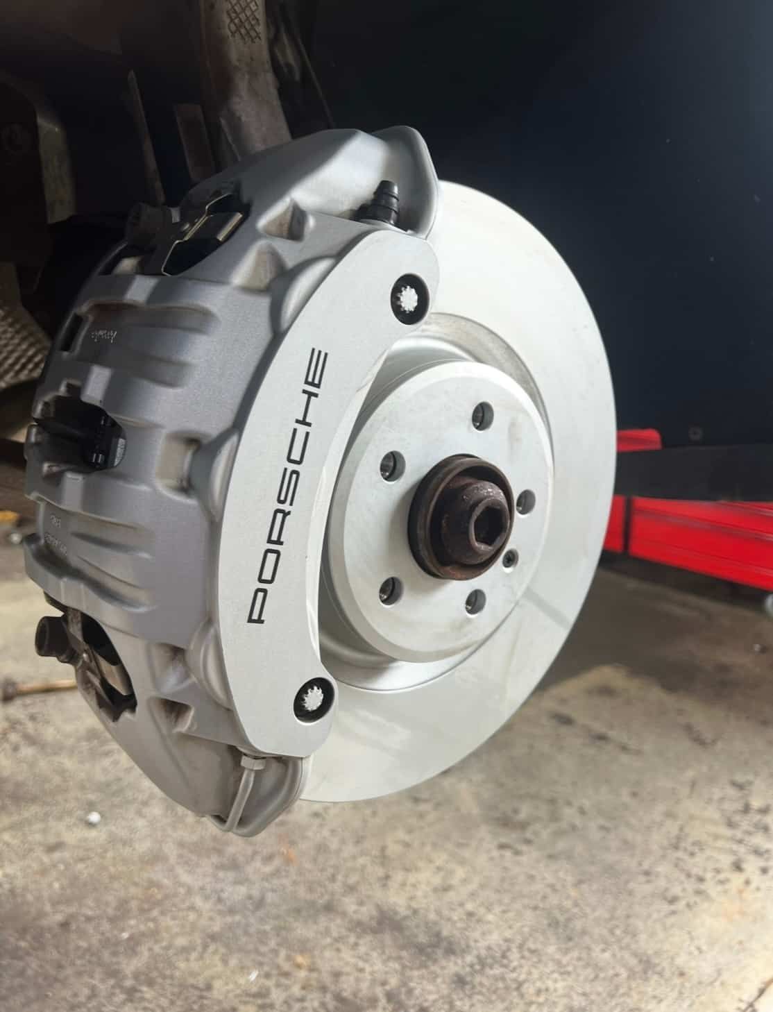 A Close Up of a Porsche Brake Disc on a Car — AWS Mechanical in Stuart Park, NT
