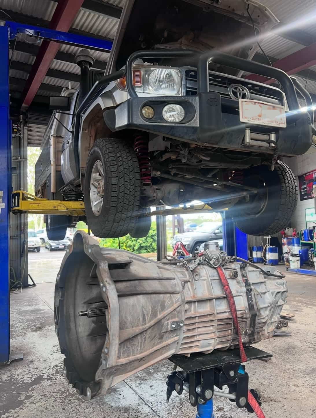 A Truck is Sitting on a Lift in a Garage — AWS Mechanical in Stuart Park, NT