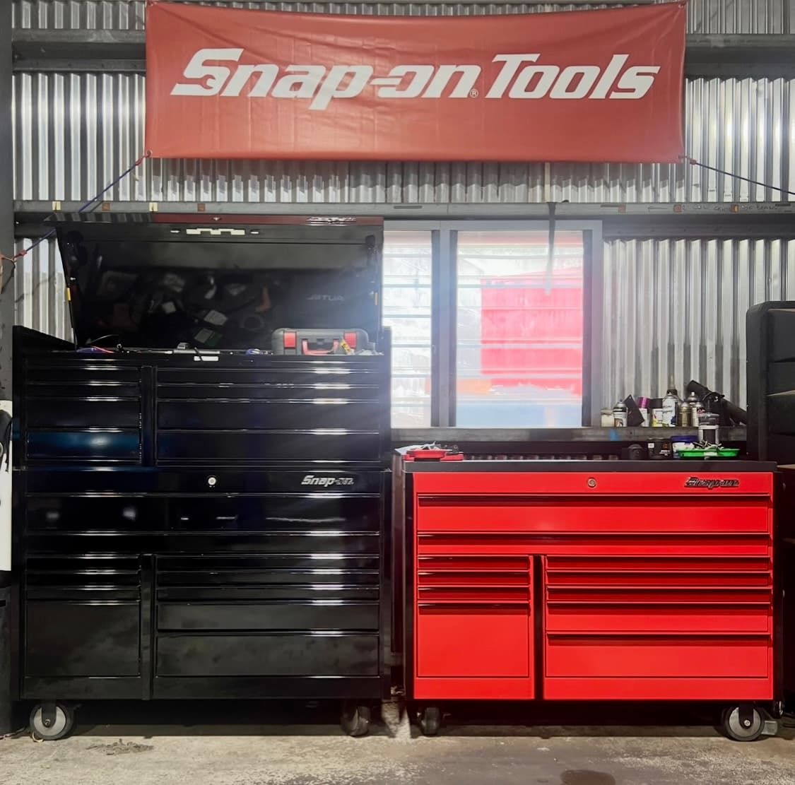 A Snap on Tools Sign Hangs Above a Black Toolbox and a Red Toolbox — AWS Mechanical in Stuart Park, NT