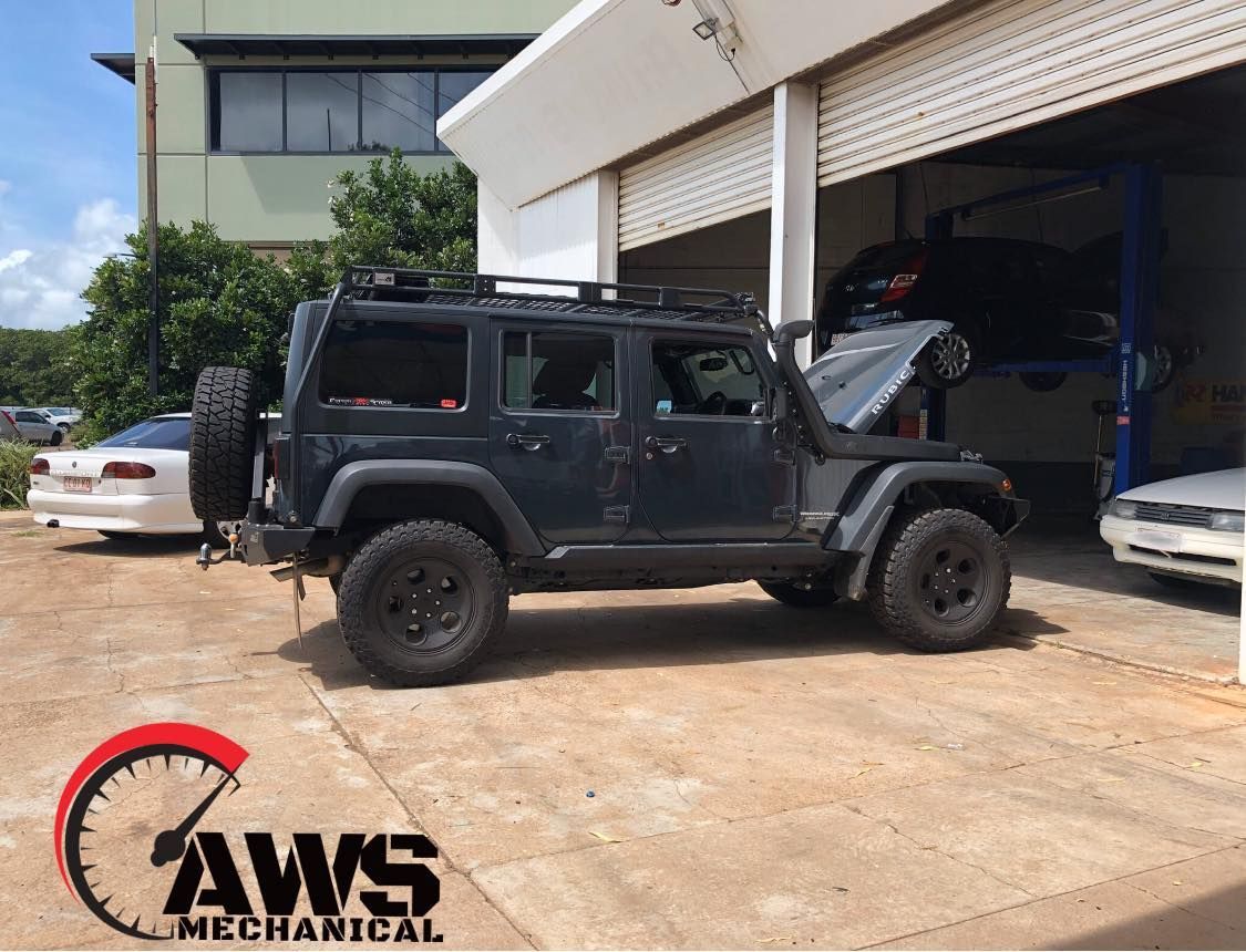 A Black Jeep Wrangler With A Roof Rack — AWS Mechanical in Stuart Park, NT