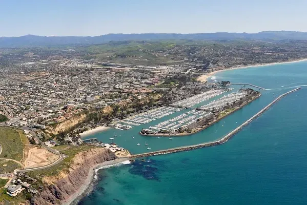 An aerial view of a city next to a body of water.