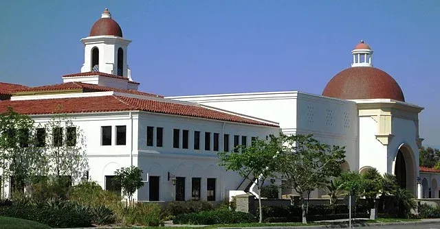 A large white building with a dome on top of it