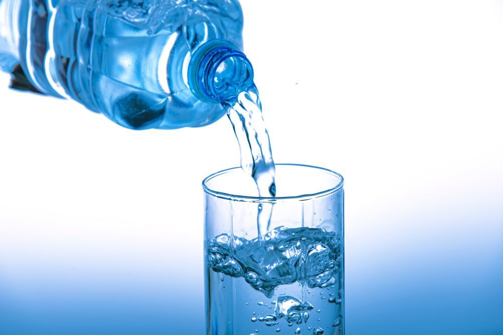 Water Pouring From a Plastic Bottle Into a Glass — Port Macquarie Pure Water In Laurieton, NSW