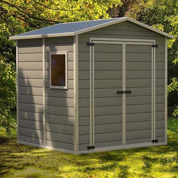 Gray outdoor storage shed with double doors and a small window, set in a grassy yard with trees.