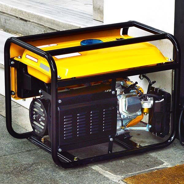 Yellow portable generator in a black metal frame on a concrete floor