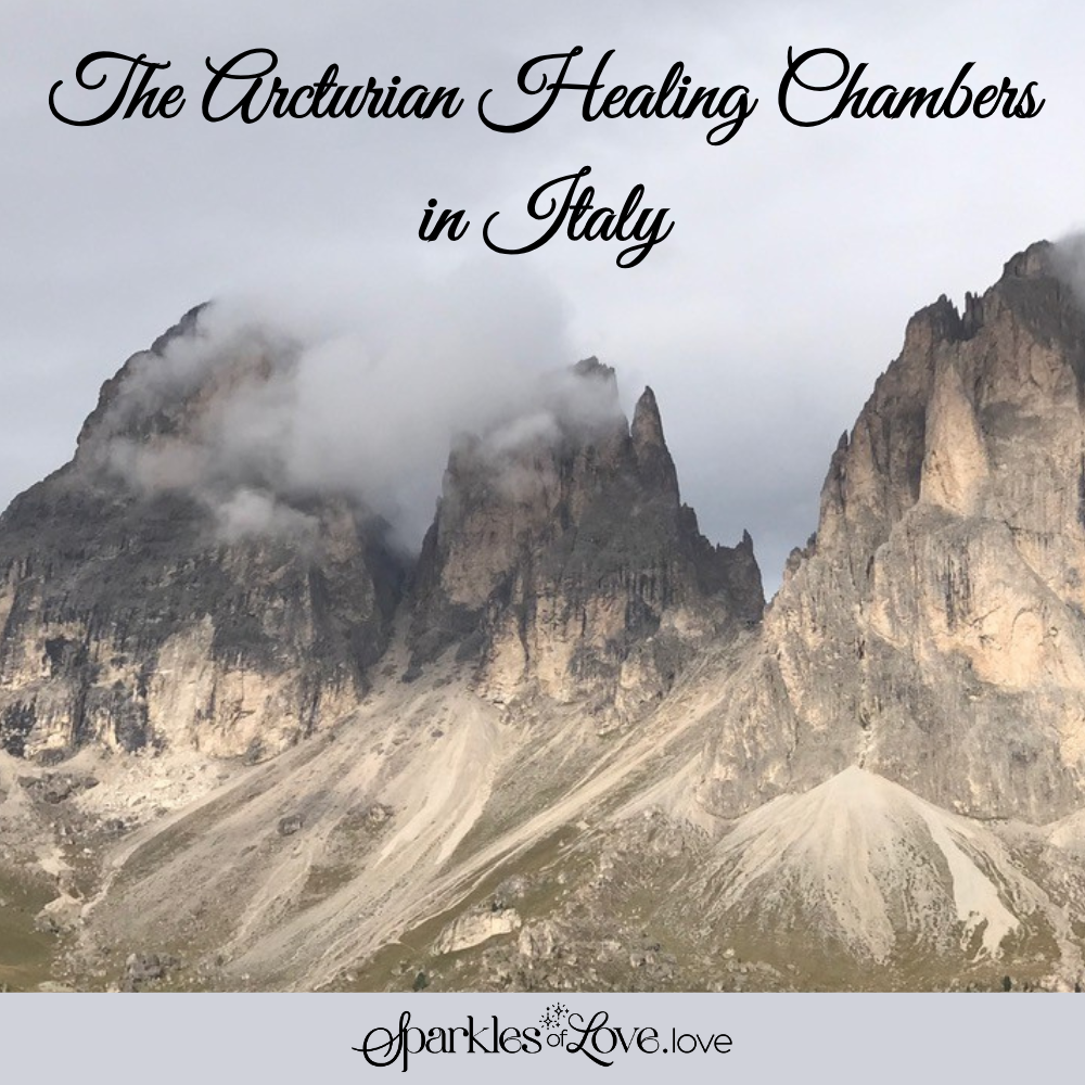Mountain peaks above clouds with title text “The Arturian Healing Chambers in Italy”