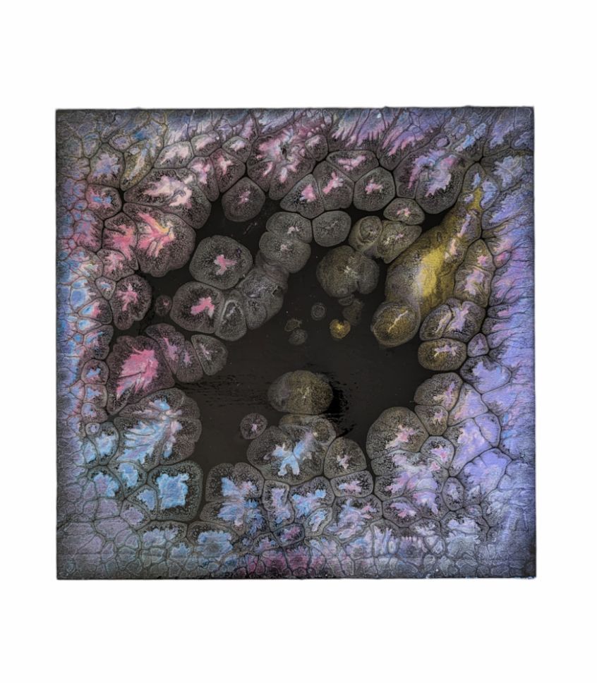 Abstract circular floral pattern in pink, blue, and purple around a dark center