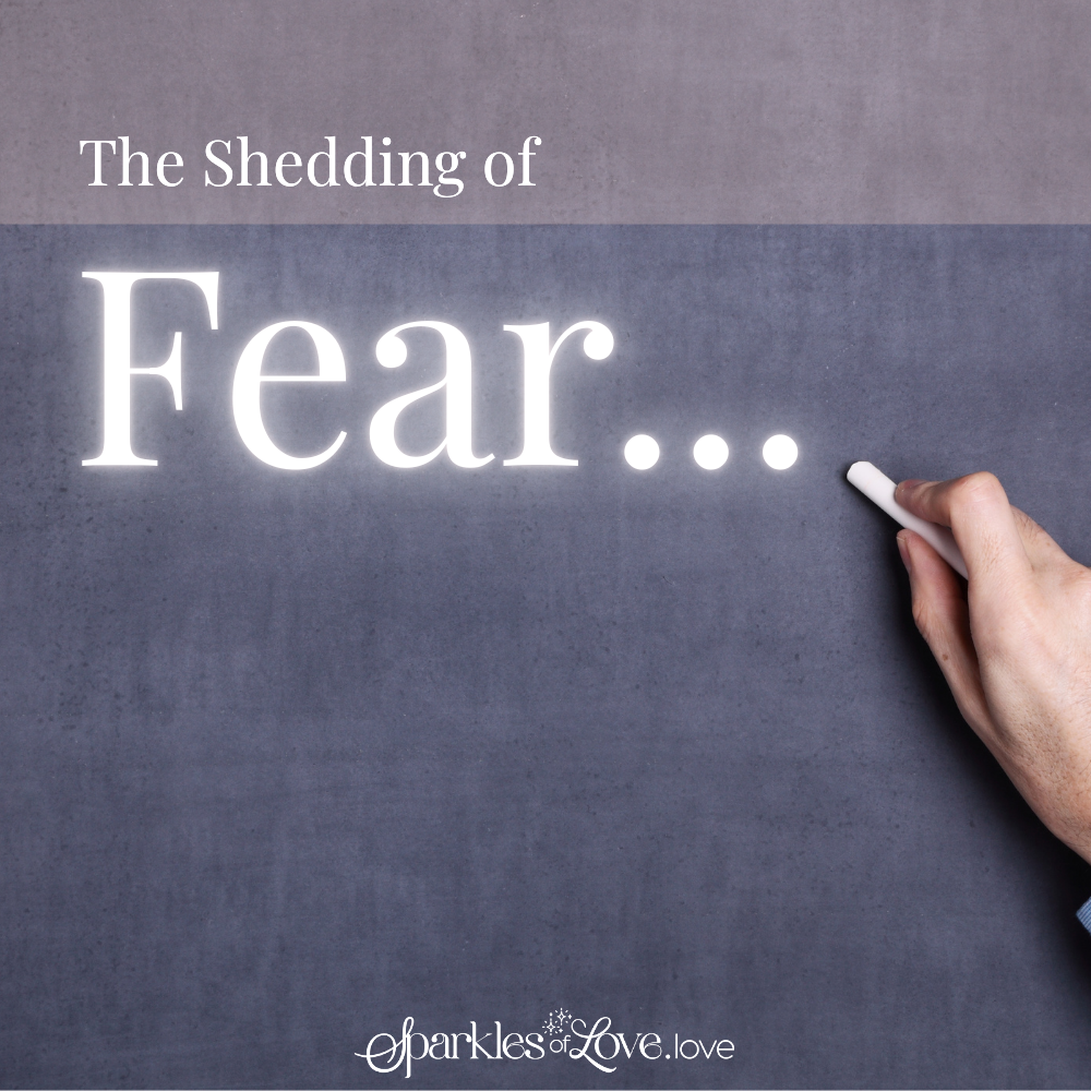 Handwriting on a chalkboard reads “The Shedding of Fear...” beside a hand holding chalk.