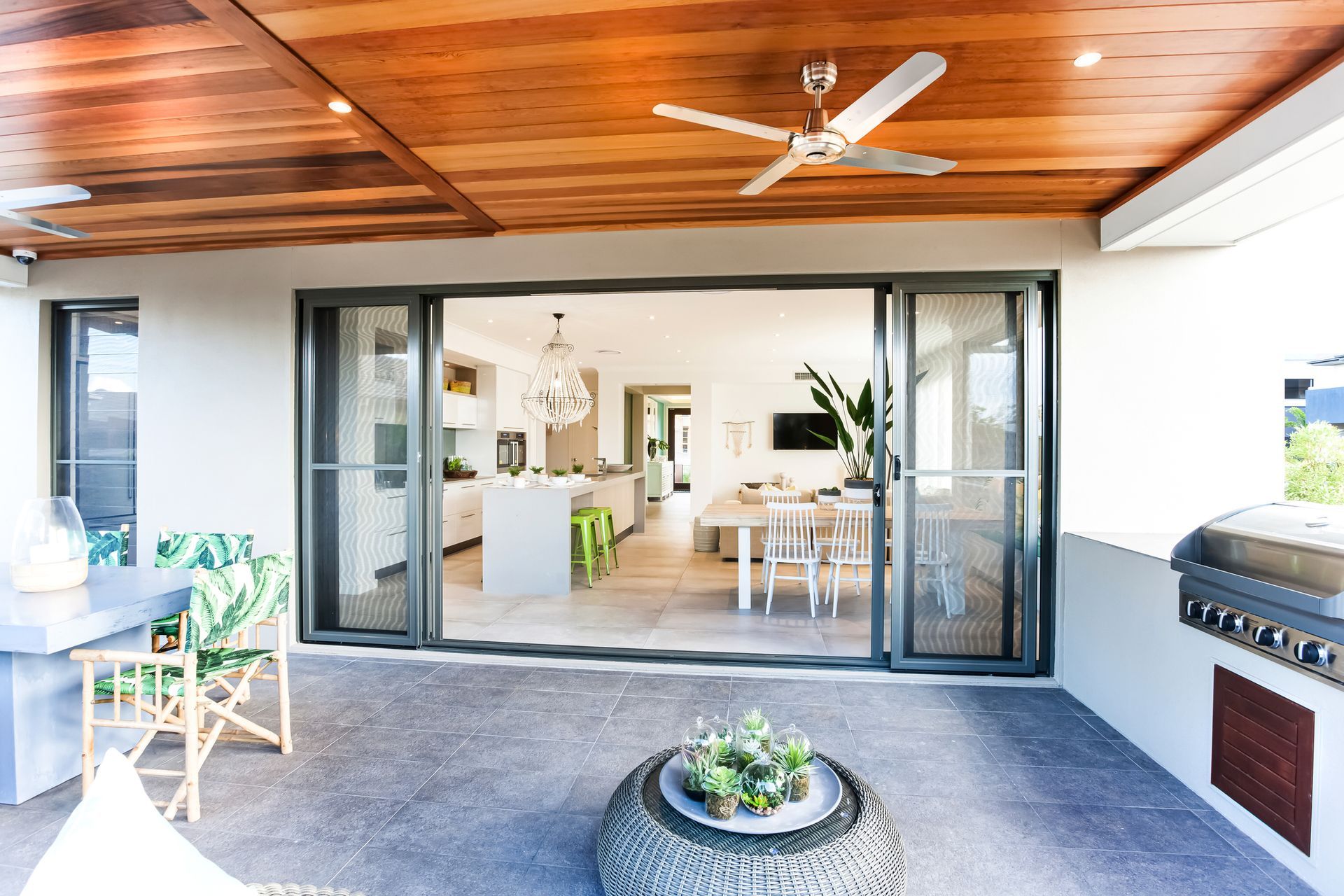 A Patio with Sliding Glass Doors and a Ceiling Fan – Concord and the Inner West - Grenic Construction Group Pty Ltd