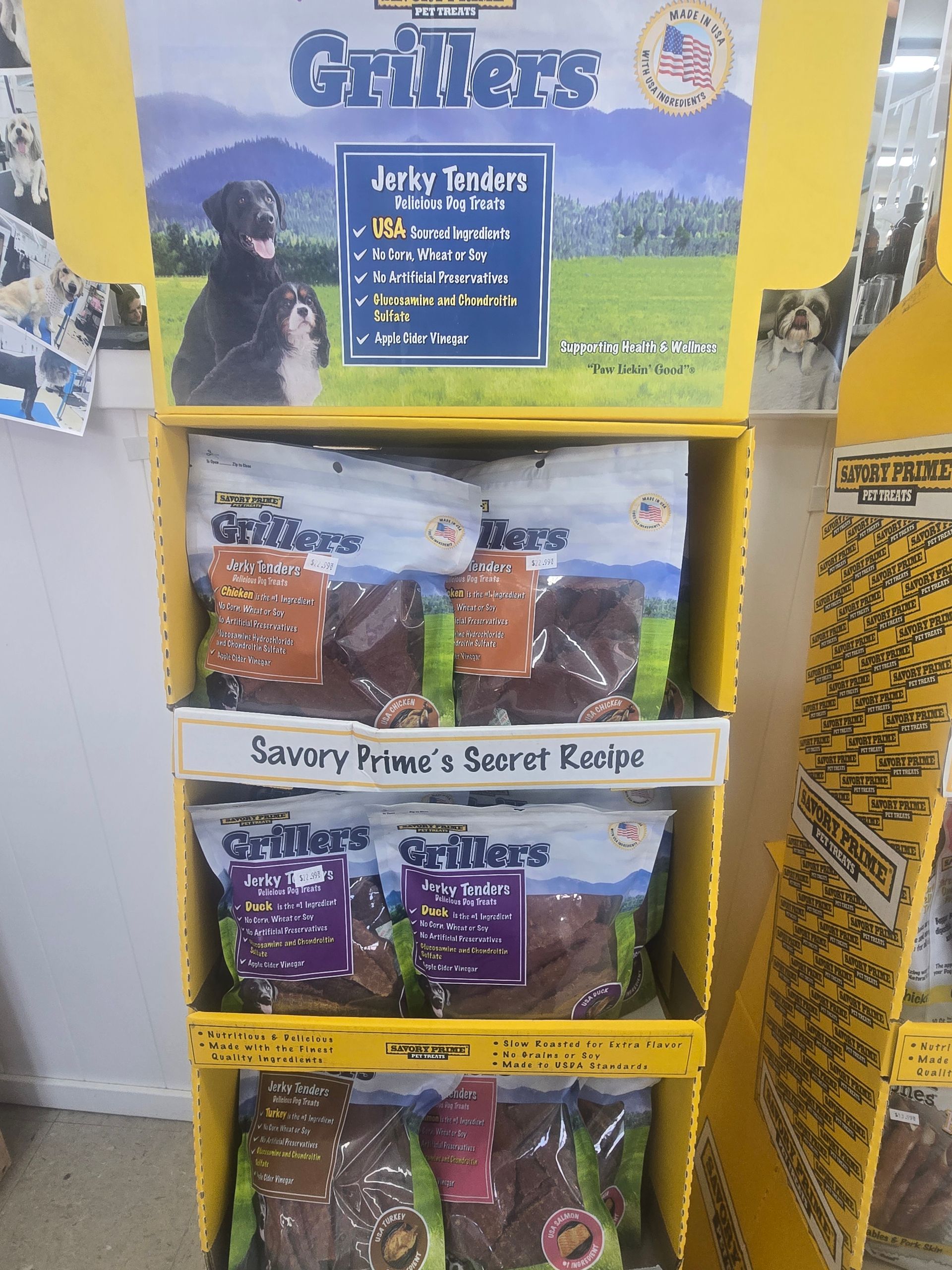 A yellow retail display rack filled with bags of 