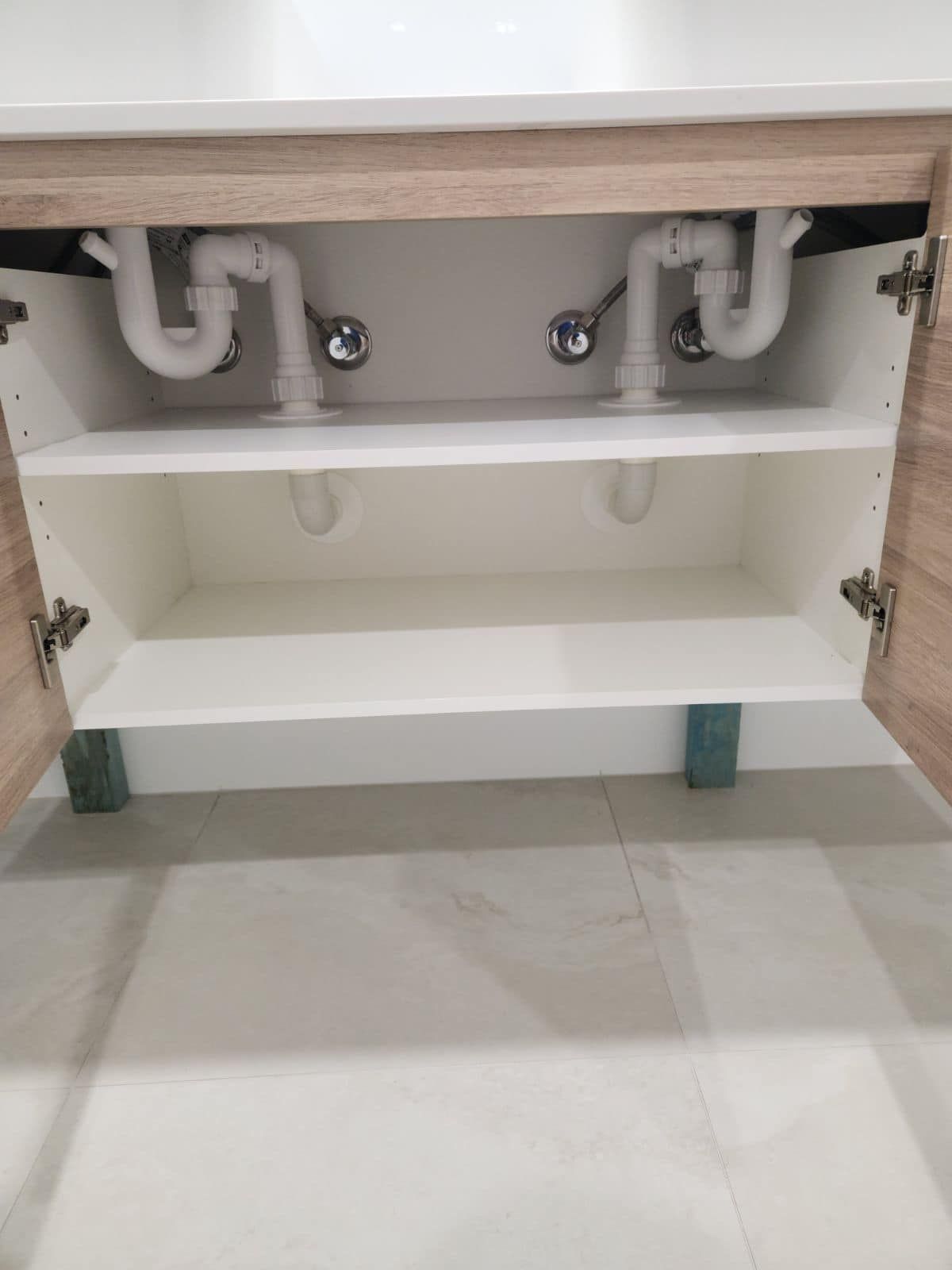 Open Bathroom Vanity With Exposed Plumbing — Medowie Plumbing & Gas in in Newcastle