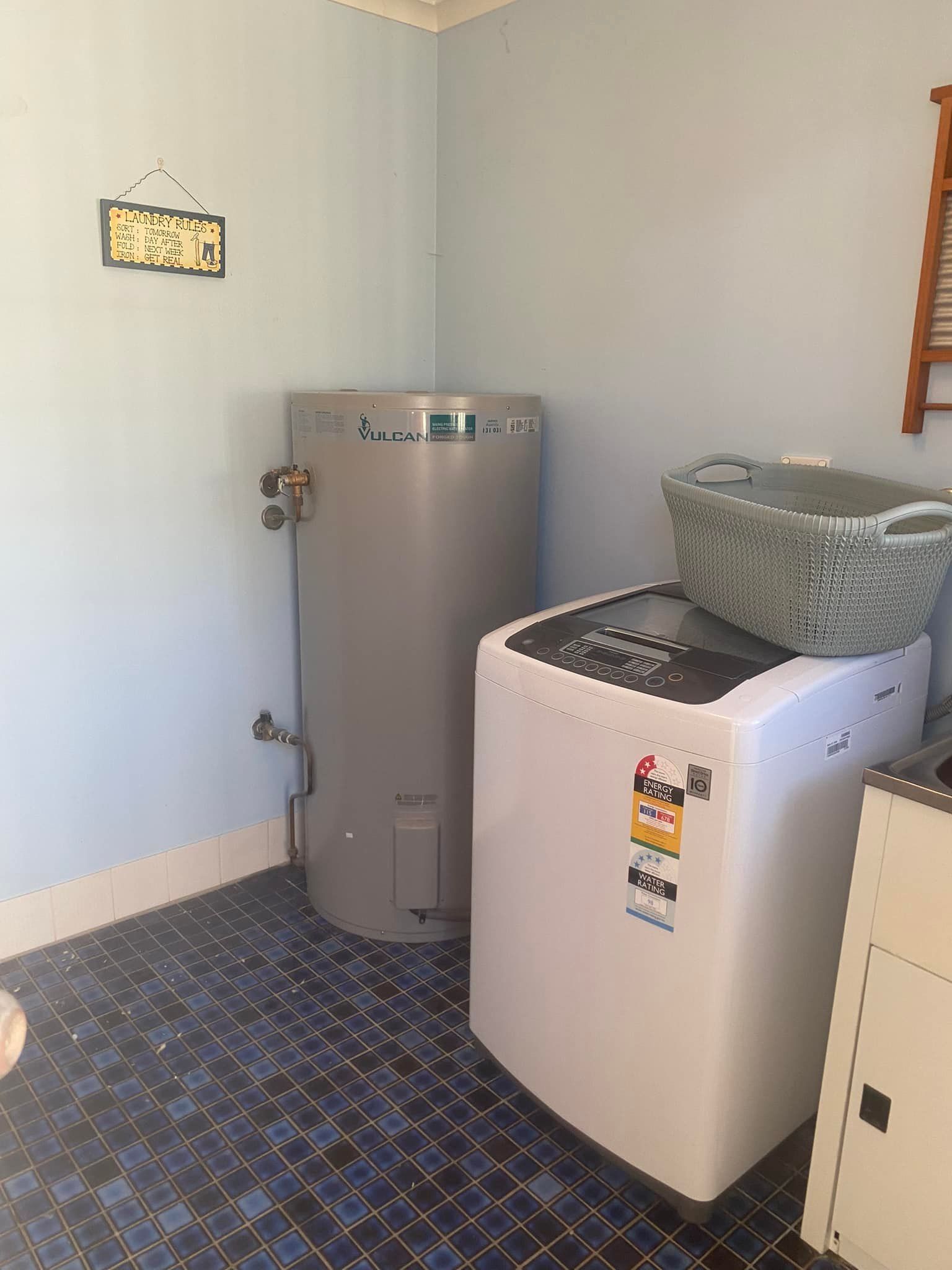 Laundry Room with A Water Heater, Washing Machine — Medowie Plumbing & Gas in in Maitland
