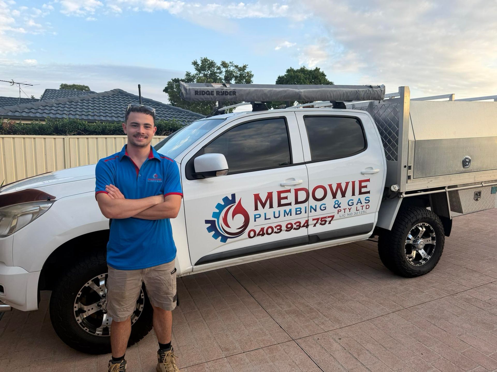 Plumber Standing in Front of His Truck — Medowie Plumbing & Gas in in Port Stephens