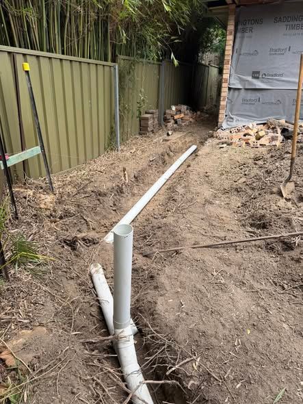 Trenched Yard With White PVC Pipe — Medowie Plumbing & Gas in in Newcastle