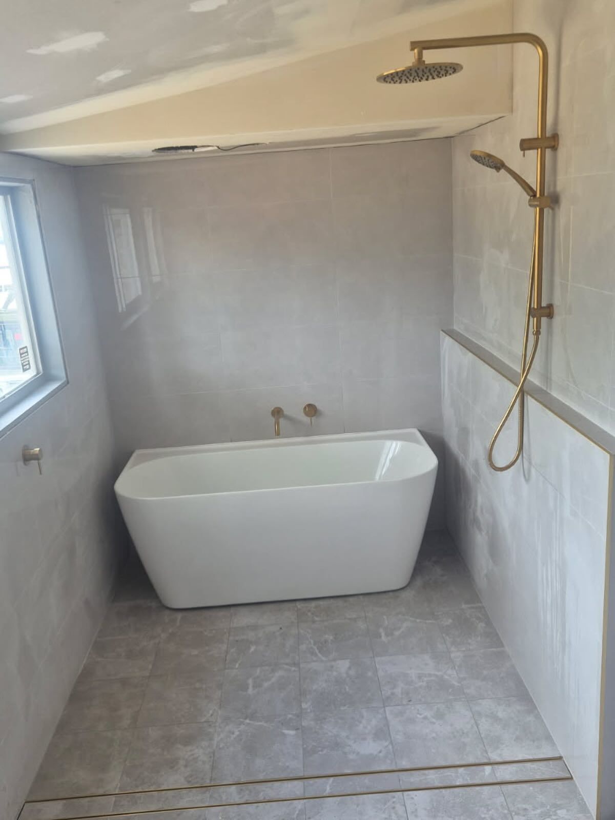 Freestanding Bathrub with Water Faucet Extending From the Floor — Medowie Plumbing & Gas In Medowie, NSW