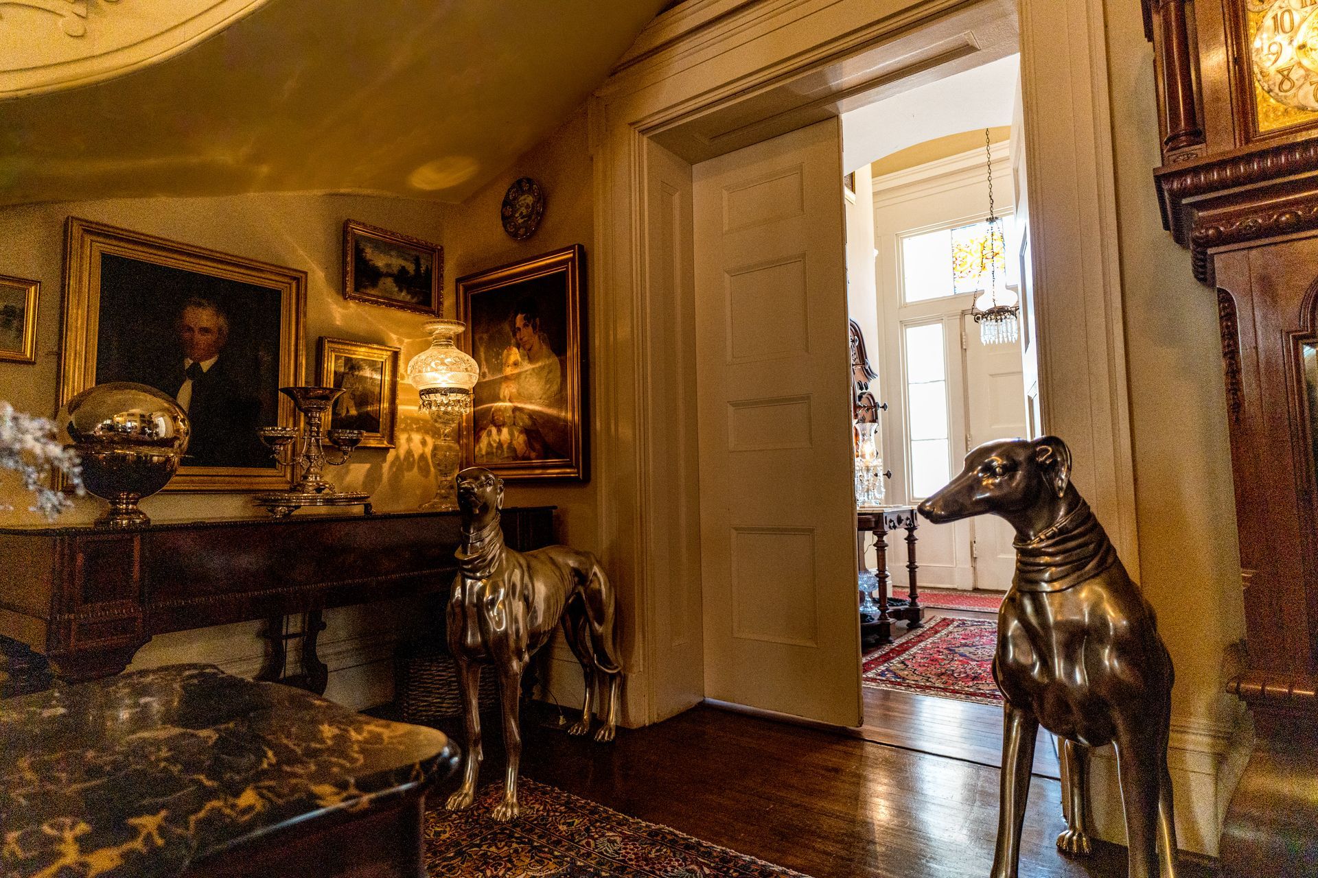 There are two statues of dogs in the room.