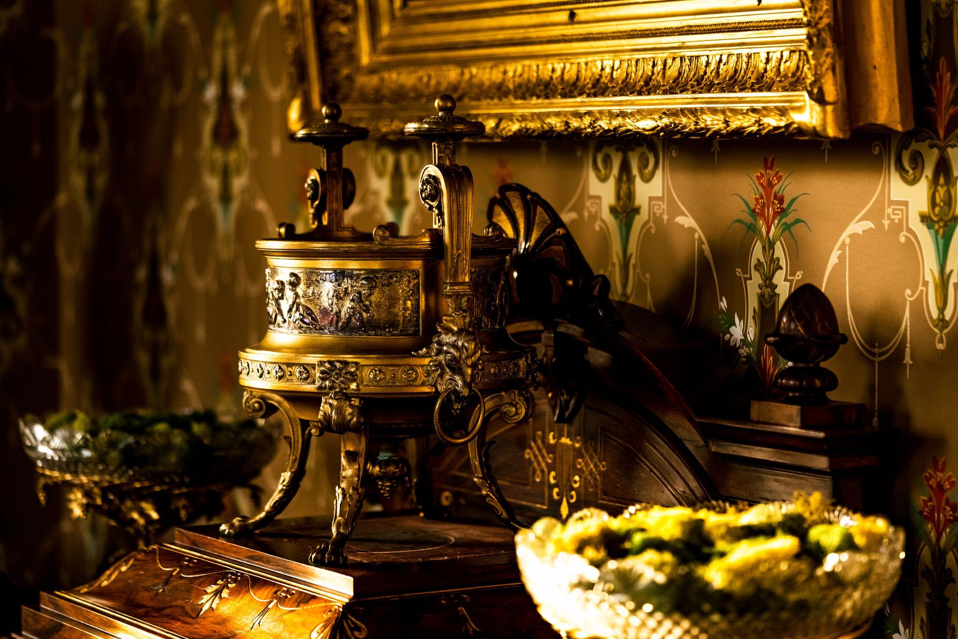 A room with a lot of antique furniture and a picture on the wall.