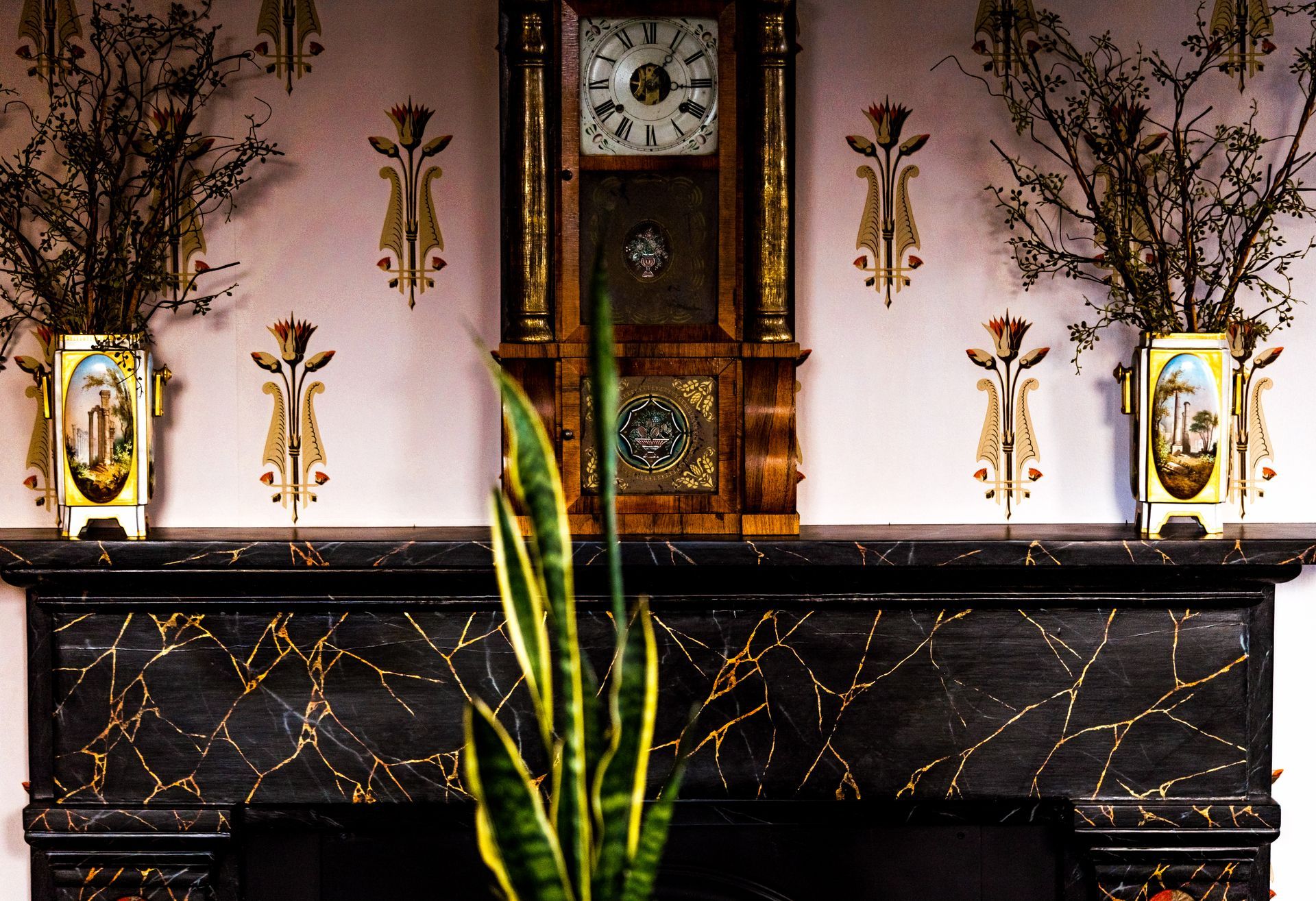 A fireplace with a clock on top of it