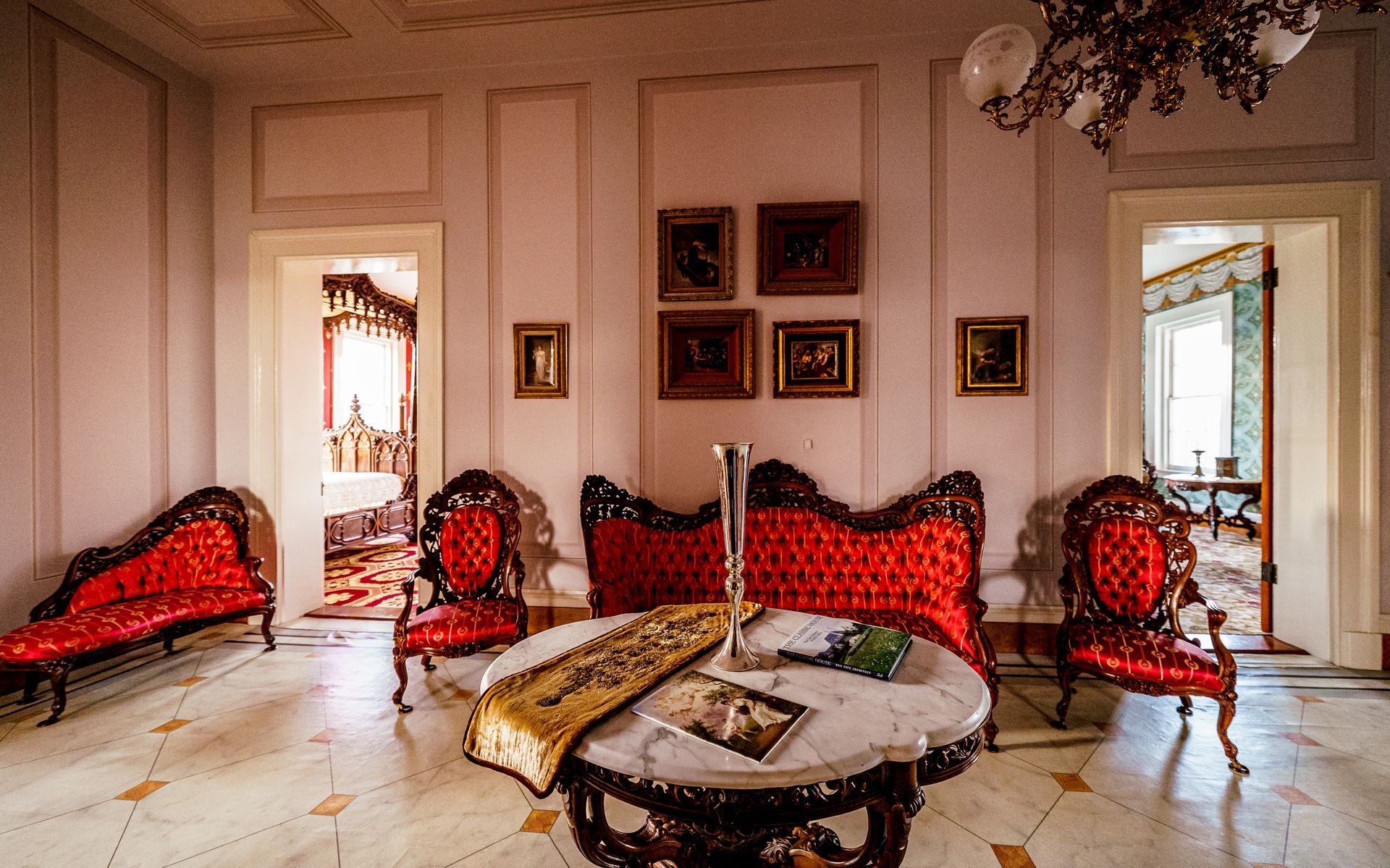 A living room with a couch and chairs and a table