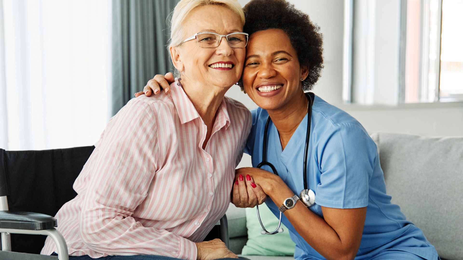 nurse and elderly patient smiling at camera at Quality LIfe Services Sugar Creek Nursing home