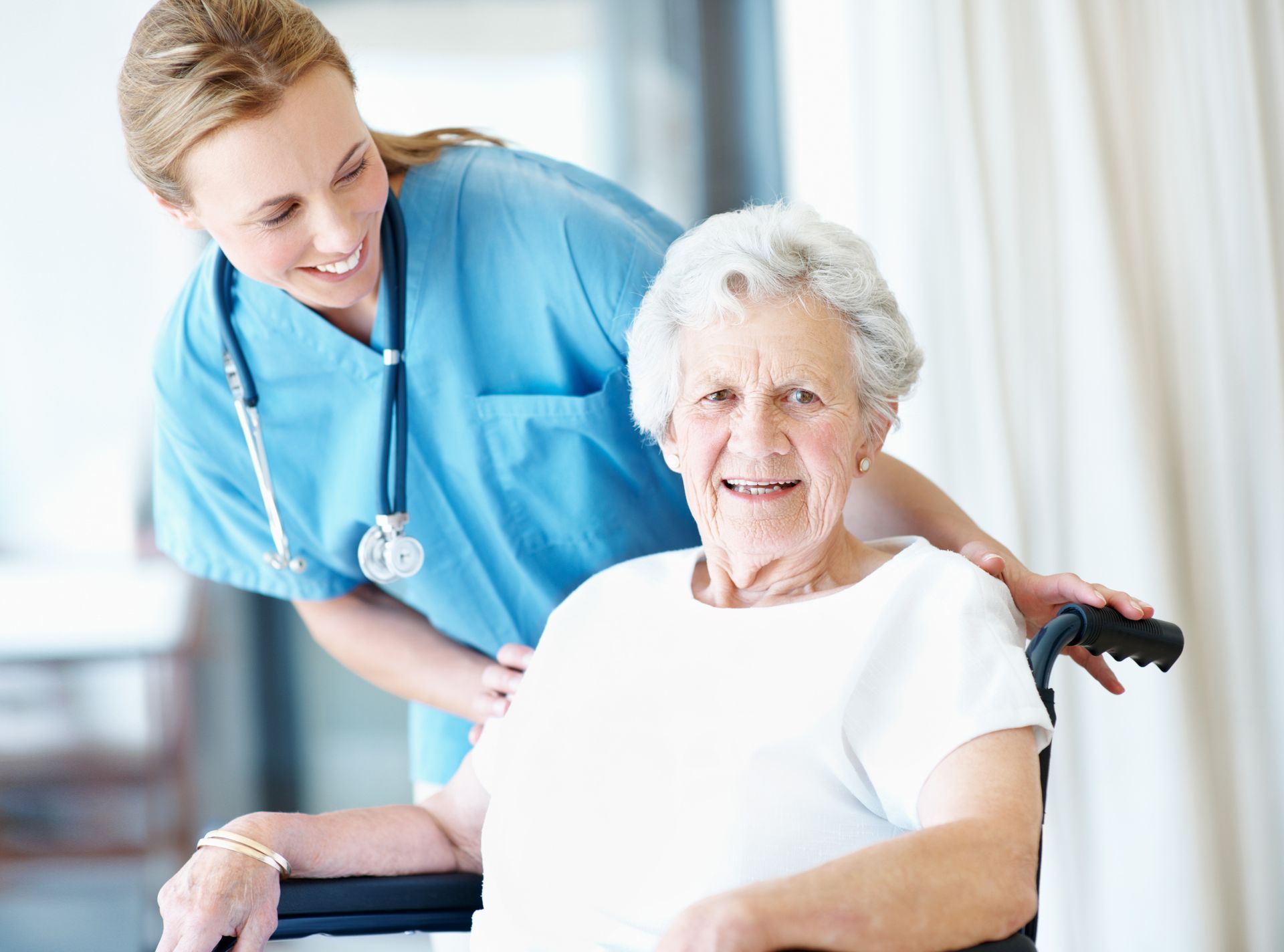 frequently asked questions image for Quality Life Services New Castle page featuring nurse and woman in wheel chair