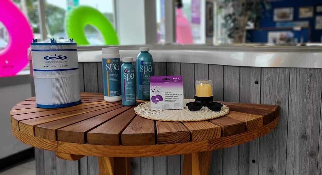 Round wooden table with pool maintenance supplies
